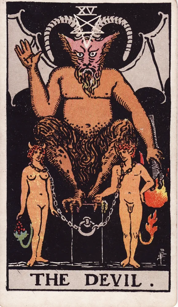 A horned, winged shadowy figure on a dark pedestal, two small robed figures loosely chained below