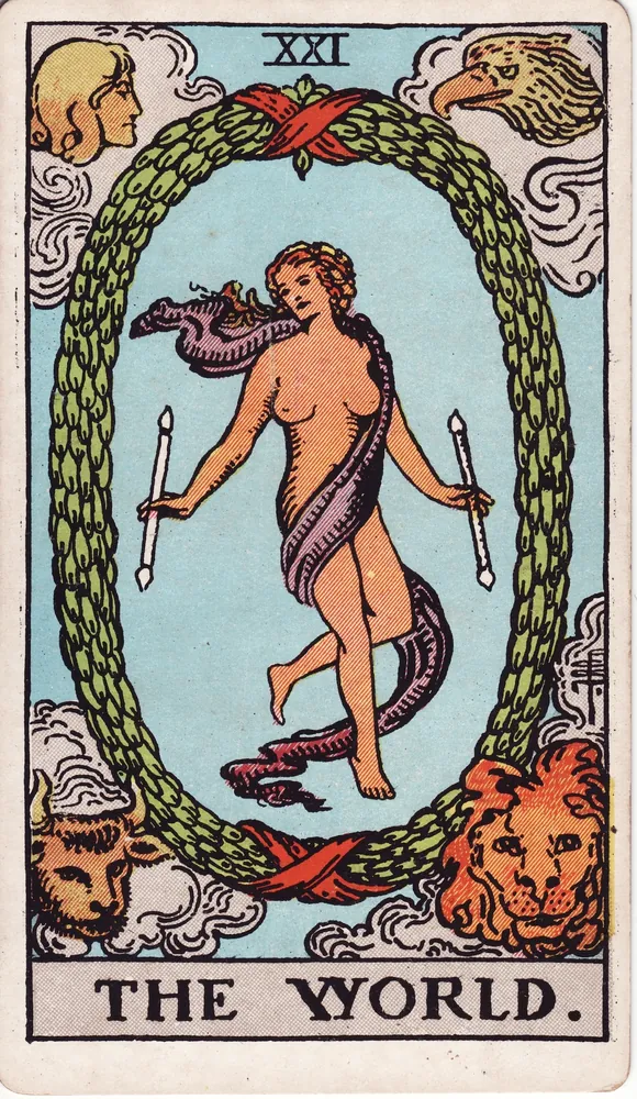 A dancer in a flowing sash within an oval laurel wreath, winged figures in the four corners